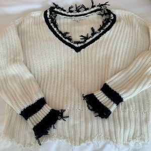 Z Supply white vneck sweater and back trim. Rough edges.